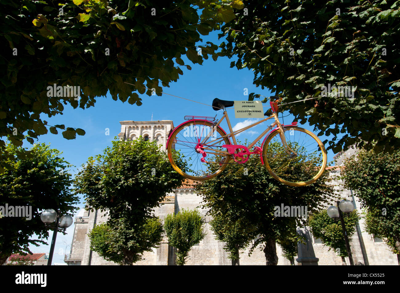 Suspended pink bicycle. Maillezais, Vendée, Pays de la Loire, France. Europe. Stock Photo
