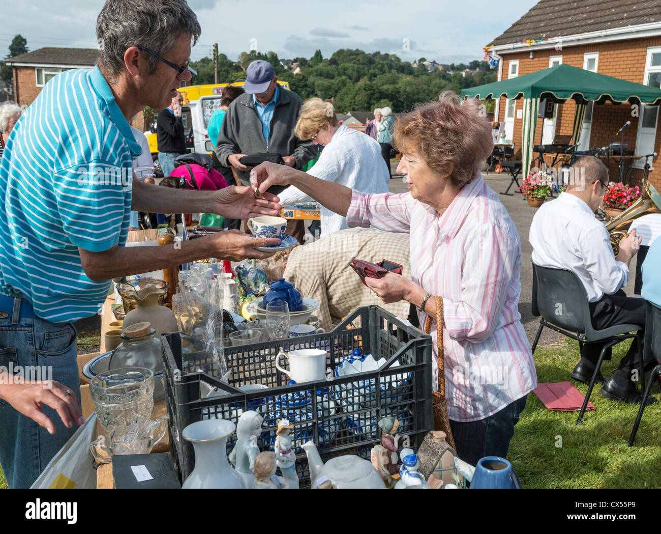 BRIC -A -BRAC STALL AT CHURCH FETE WITH CUSTOMERS GLOUCESTERSHIRE ENGLAND UK Stock Photo