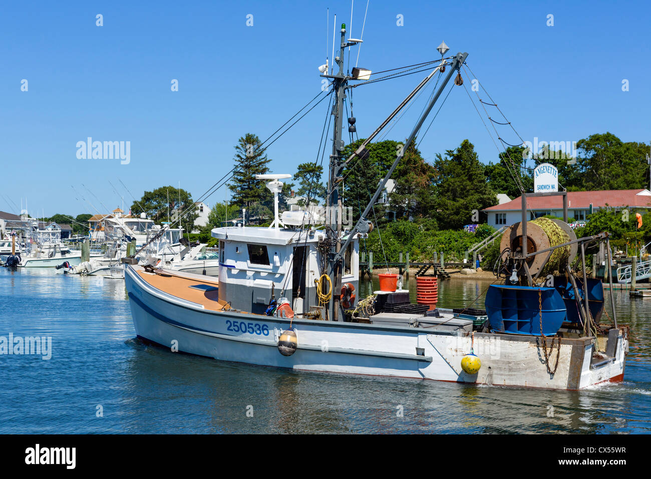 Fishing boat leaving the harbor at Hyannis, Barnstable, Cape Cod, Massachusetts, USA Stock Photo