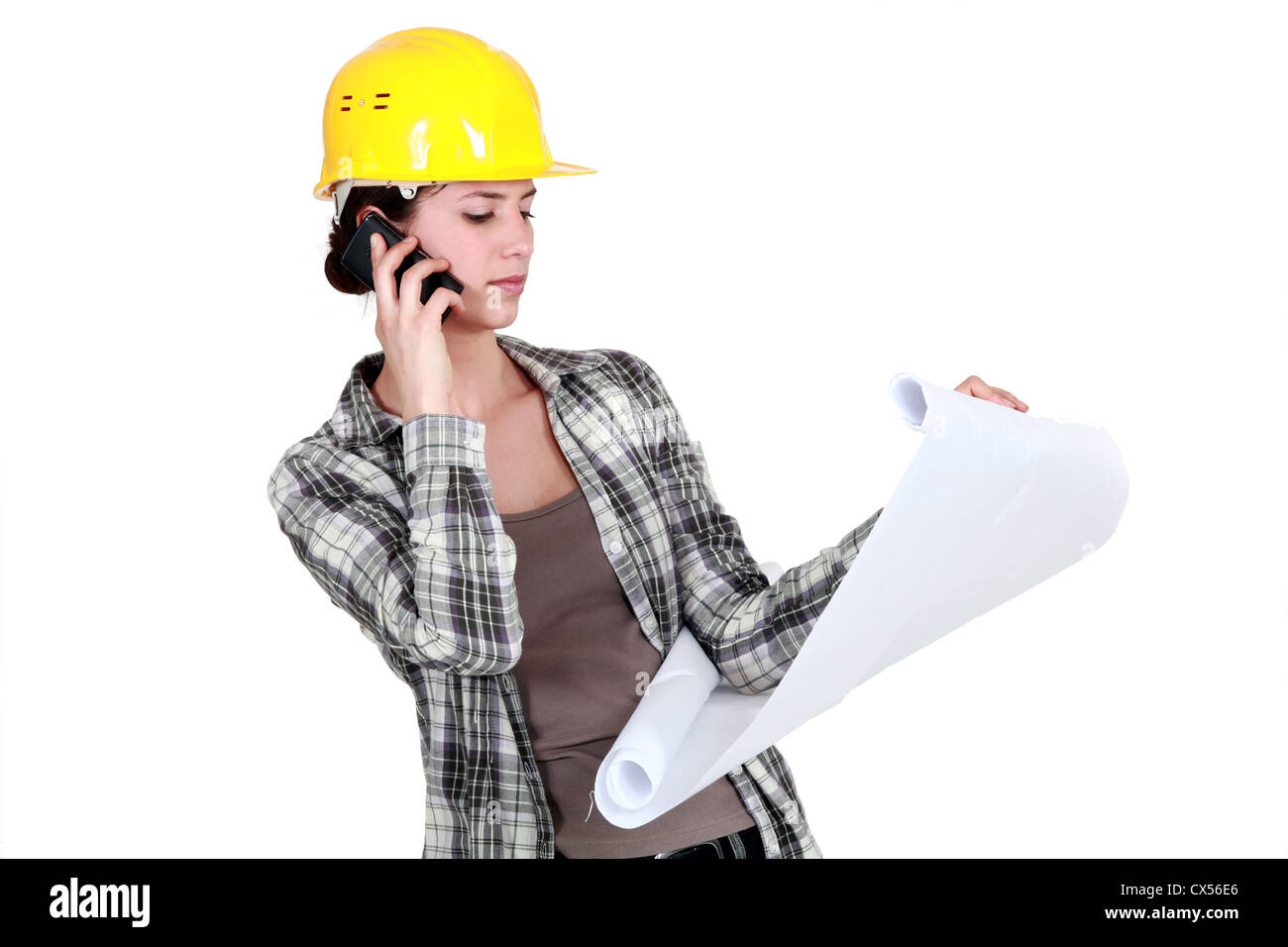 Tradeswoman reporting a problem with a blueprint Stock Photo - Alamy