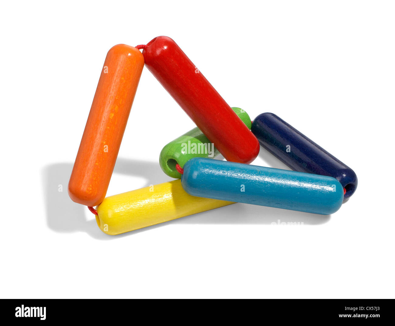 multi-colored wood triangles by haba photographed on a white background Stock Photo