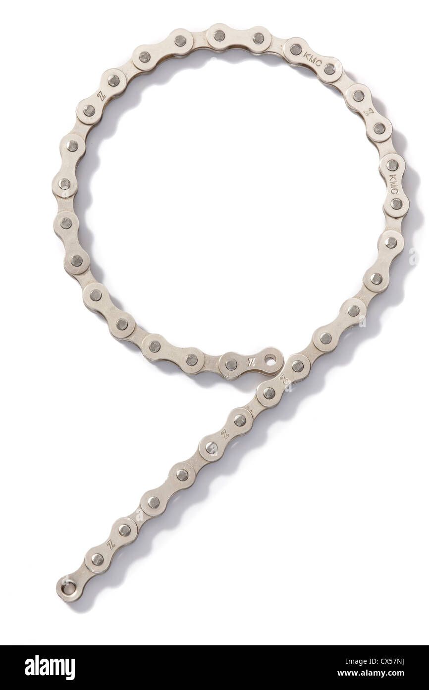 a bicycle chain shaped like a number 9 photographed on a white background Stock Photo