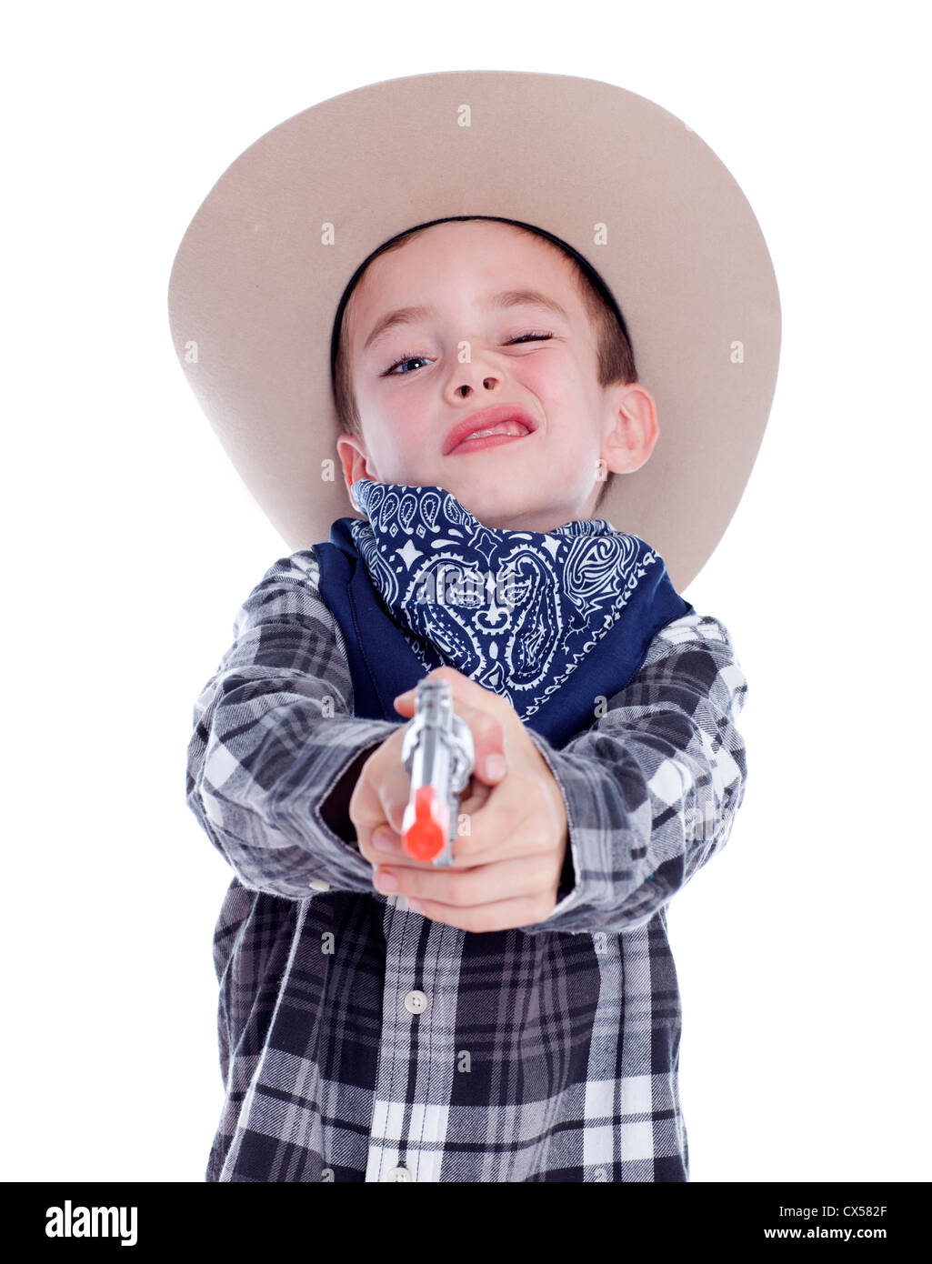 Young boy dressed as a cowboy with gun Stock Photo
