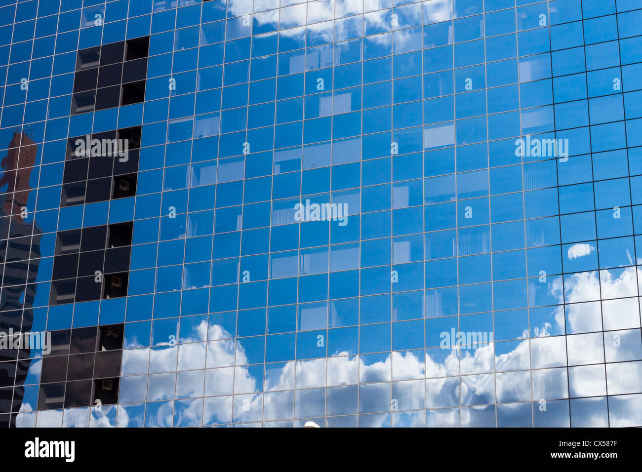 reflecting sky in glass of office building ; abstract background Stock ...