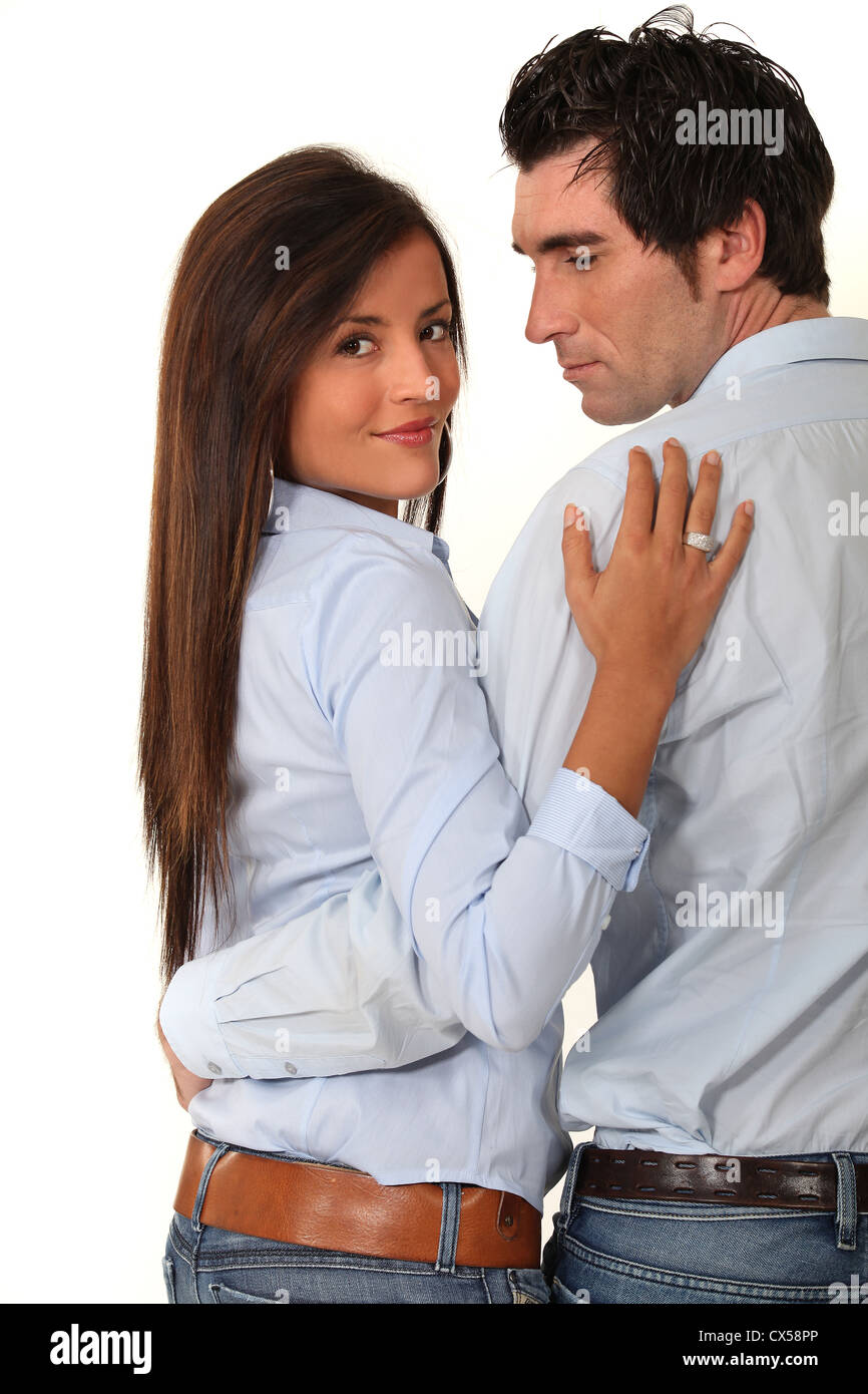 Couple with their arms around each other Stock Photo Alamy