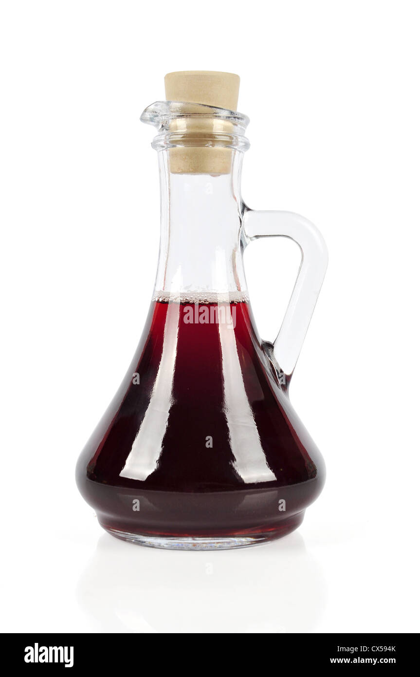 Decanter with red wine vinegar isolated on the white background. Clipping path included Stock Photo