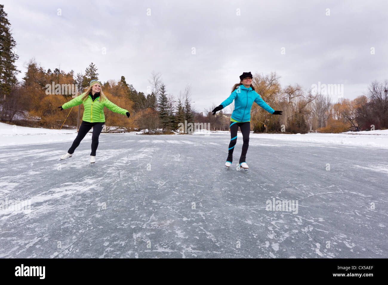 Ice skating at Woodland Park in Kalispel, Montana, USA. (MR Stock Photo