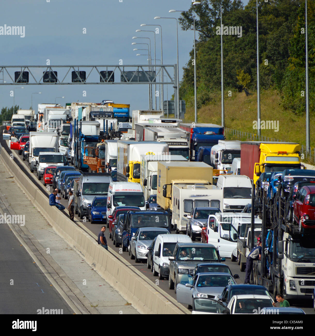 Stationary traffic tailback gridlocked on four lanes of M25 motorway Essex England UK Stock Photo