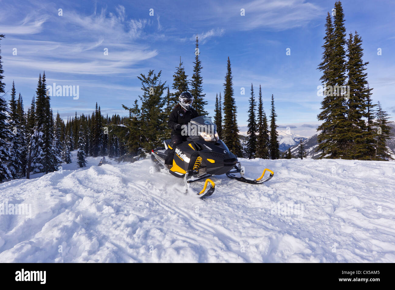 Snowmobiling on Desert Mountain in the Flathead National Forest, Montana, USA (MR) Stock Photo
