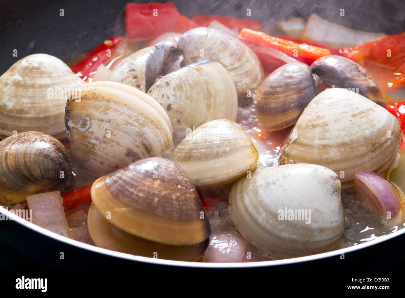 clams cooking in pan Stock Photo Alamy