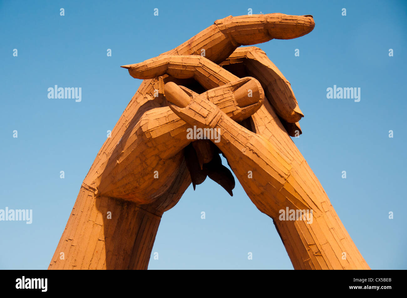 Clasping hands statue, Gretna Green, Scotland. Symbol of  marriage unity at the old blacksmith shop, venue for eloping couples. Stock Photo