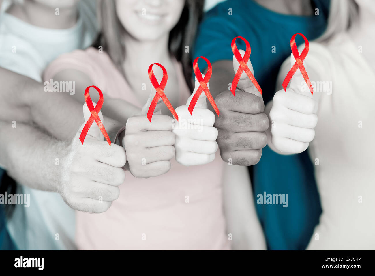 group of young multiracial people supporting AIDS HIV prevention Stock