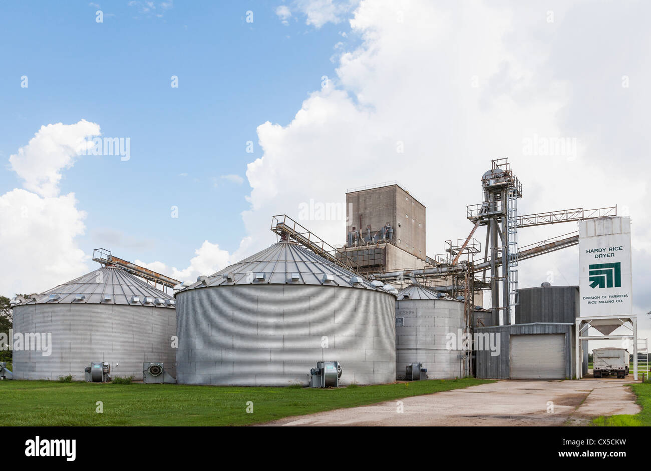 Grain Elevator with rice dryer bins, storage silos and truck loader at