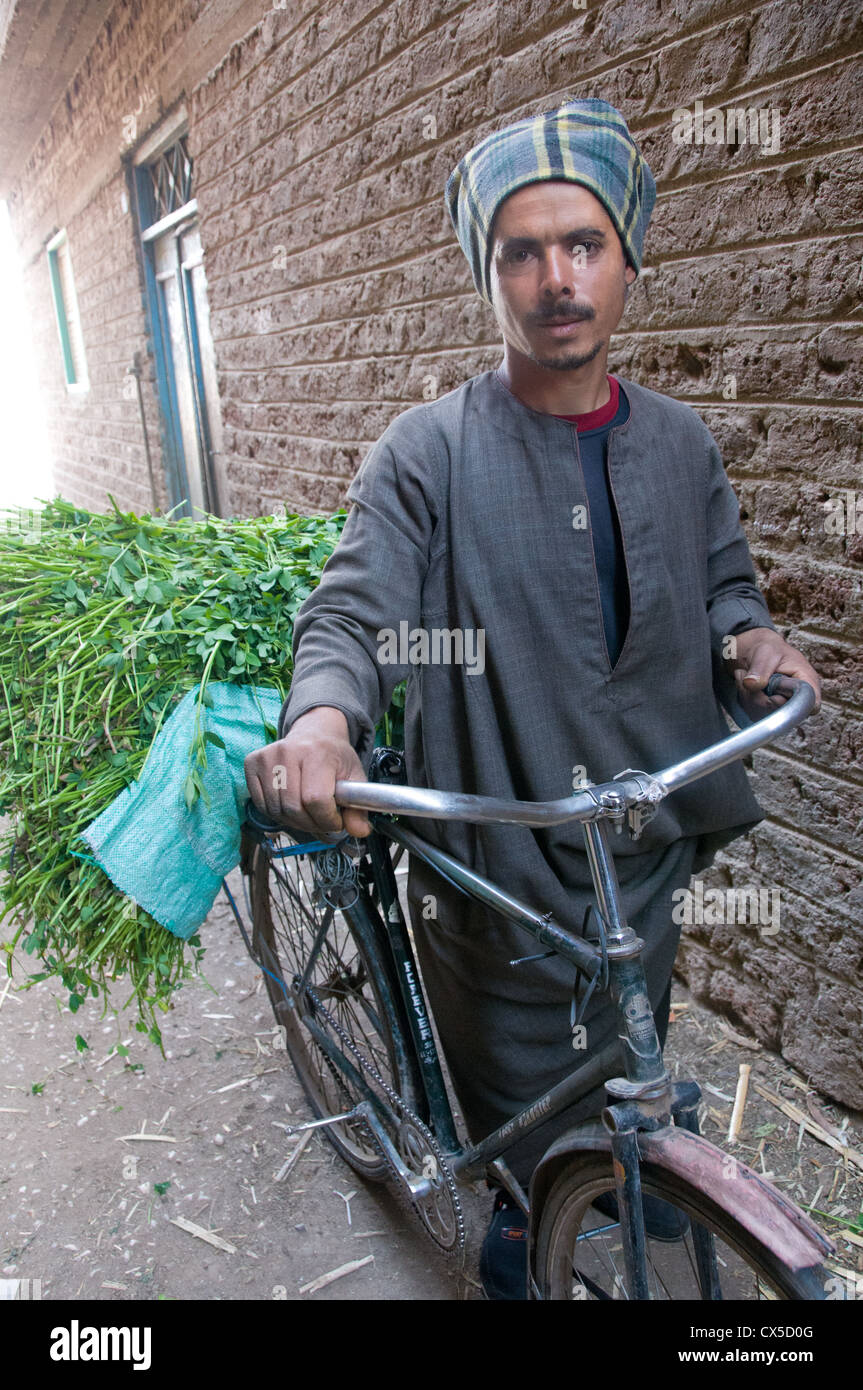 Peasant Man and his bike in Asyut Governorate Egypt Stock Photo