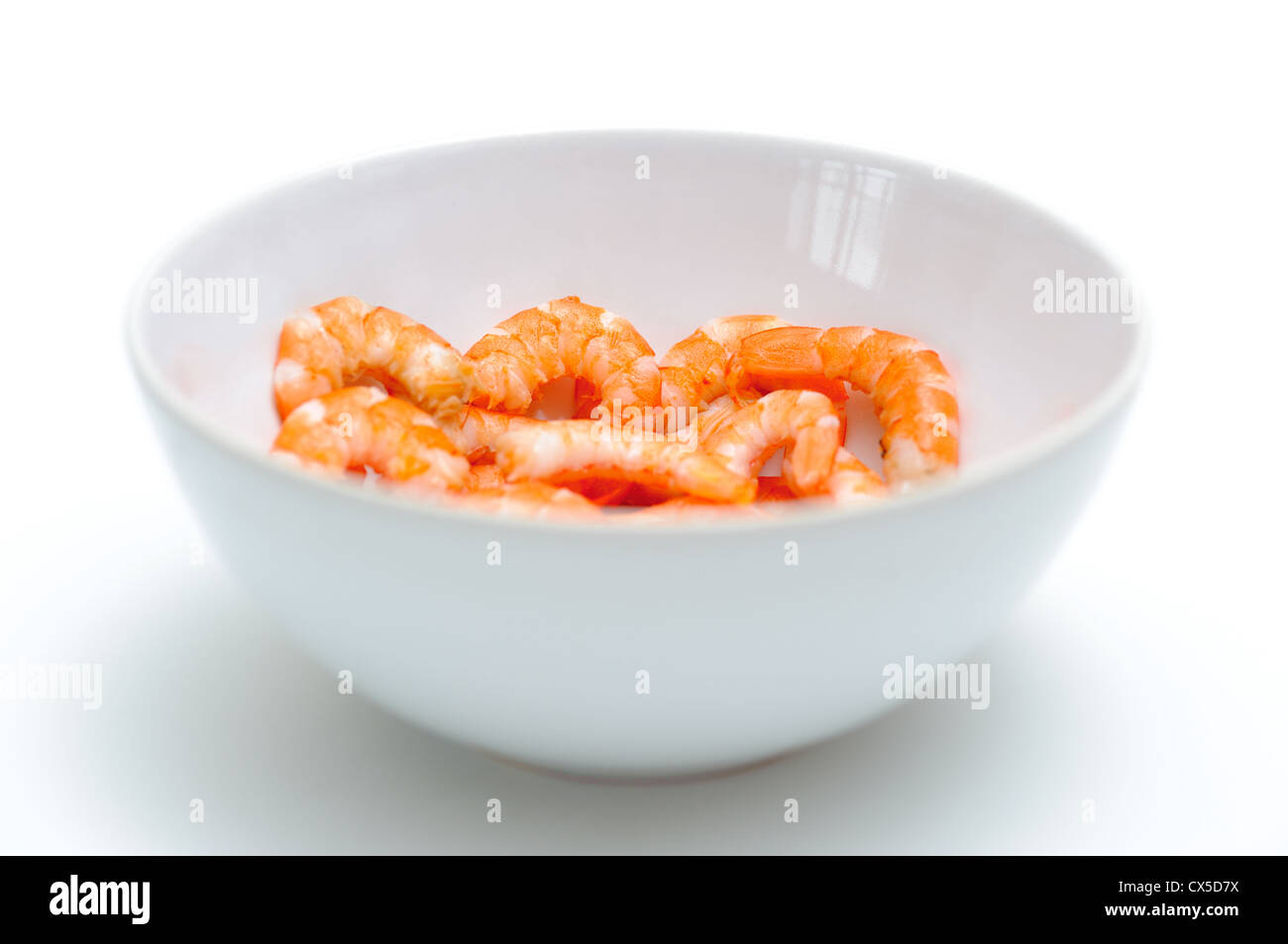 Hulled shrimp in the bowl over white Stock Photo