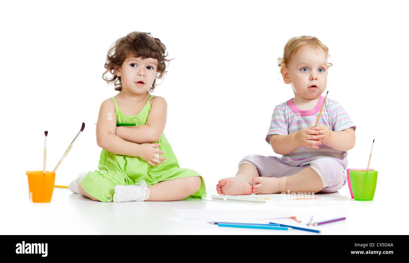 Children group painting with brush in studio isolated Stock Photo