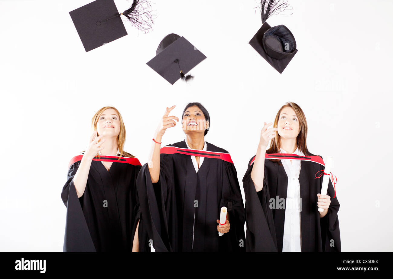 group of female graduates throwing graduation cap Stock Photo Alamy