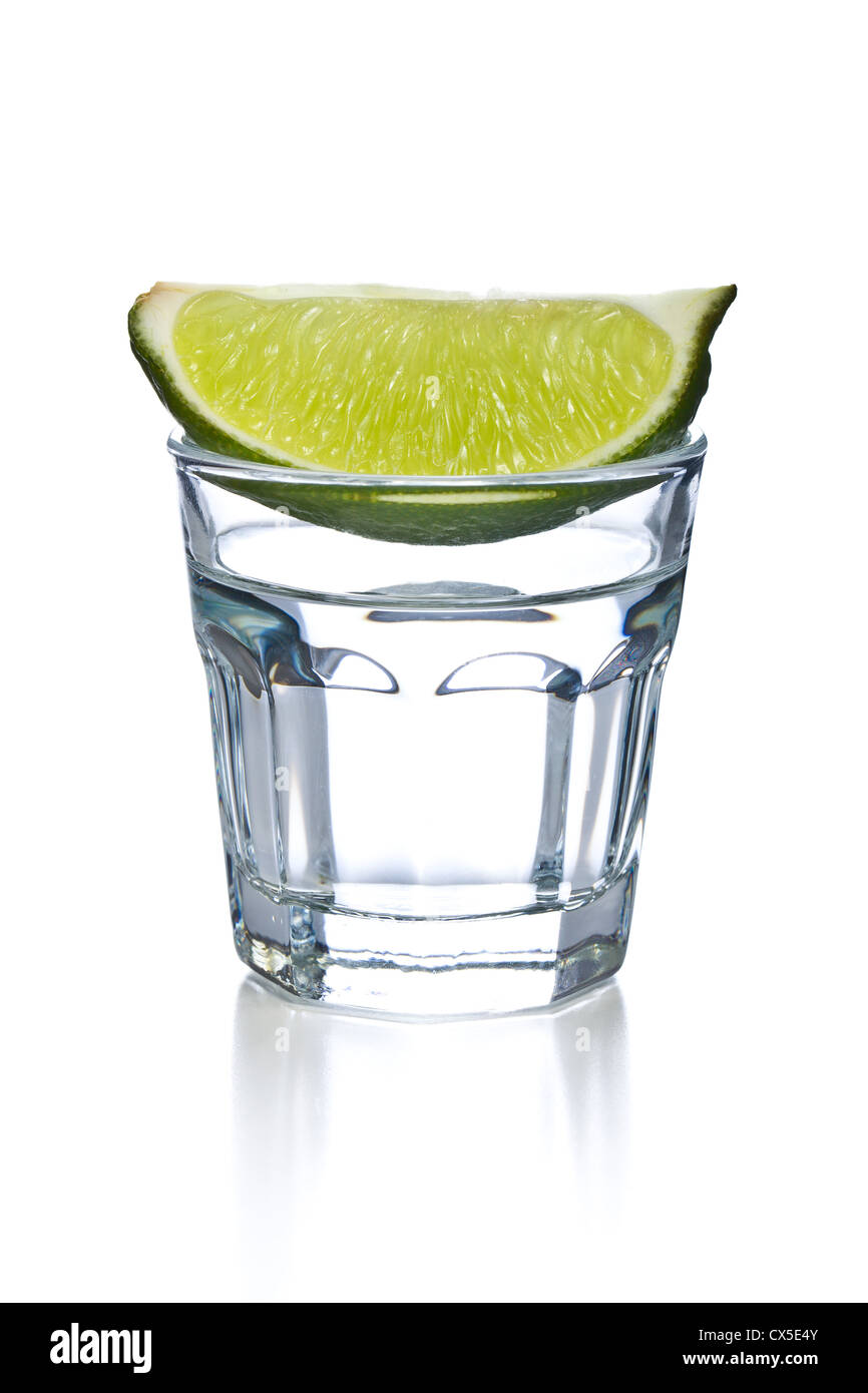 glass of clear alcohol on white background Stock Photo