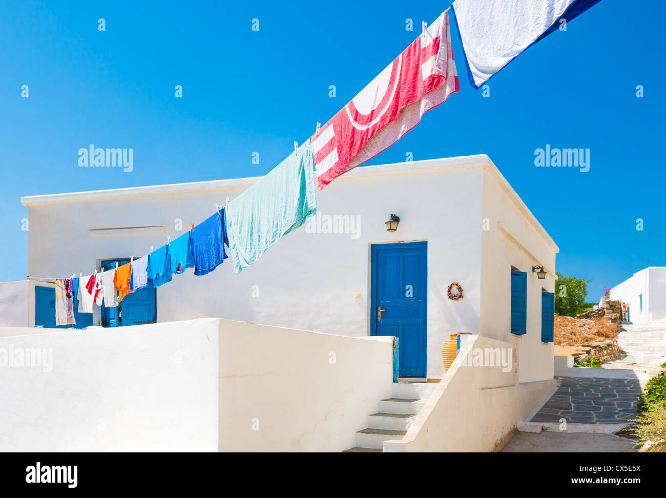 Laundry line outside Greek island house Stock Photo