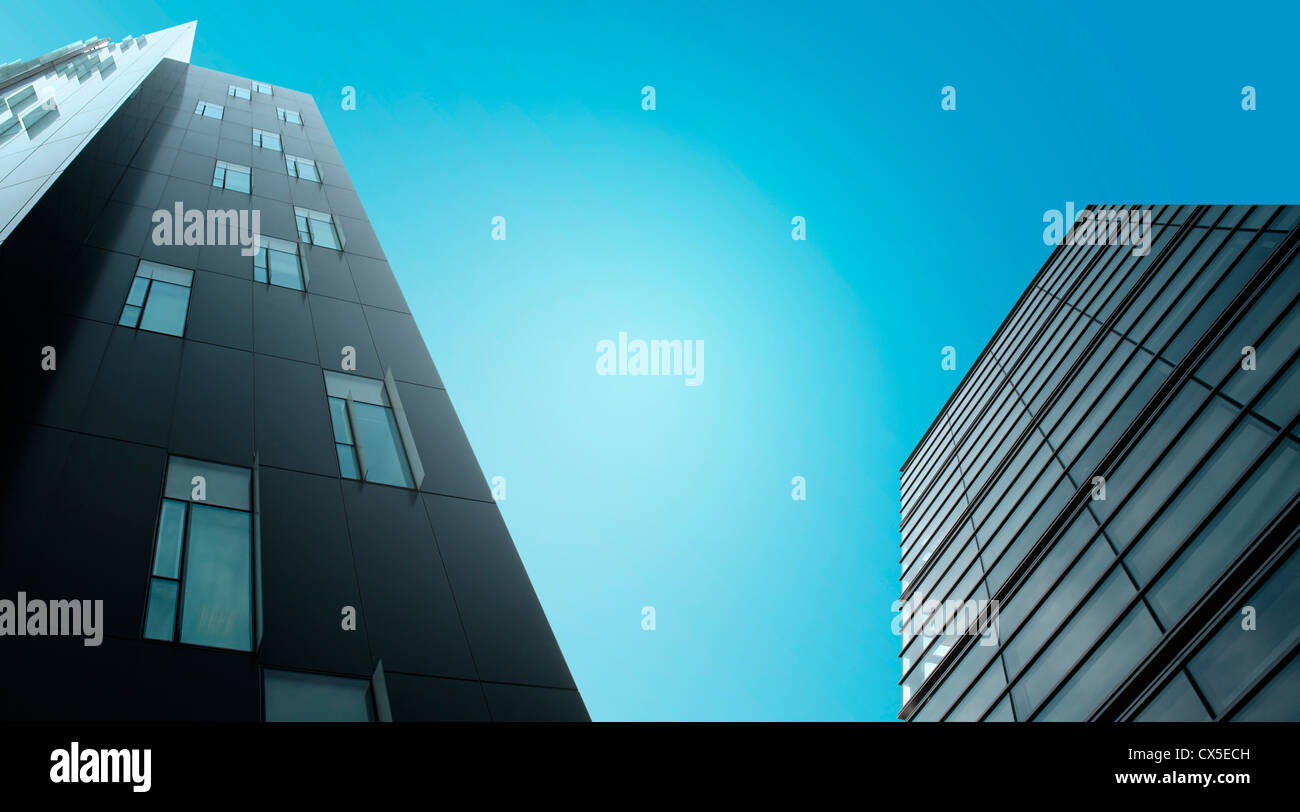 Modern skyscrapers over blue sky Stock Photo - Alamy