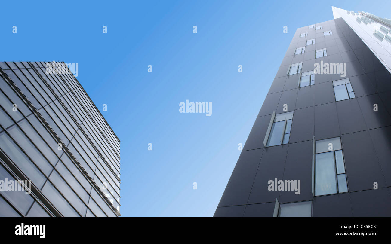 Modern skyscrapers over blue sky Stock Photo - Alamy