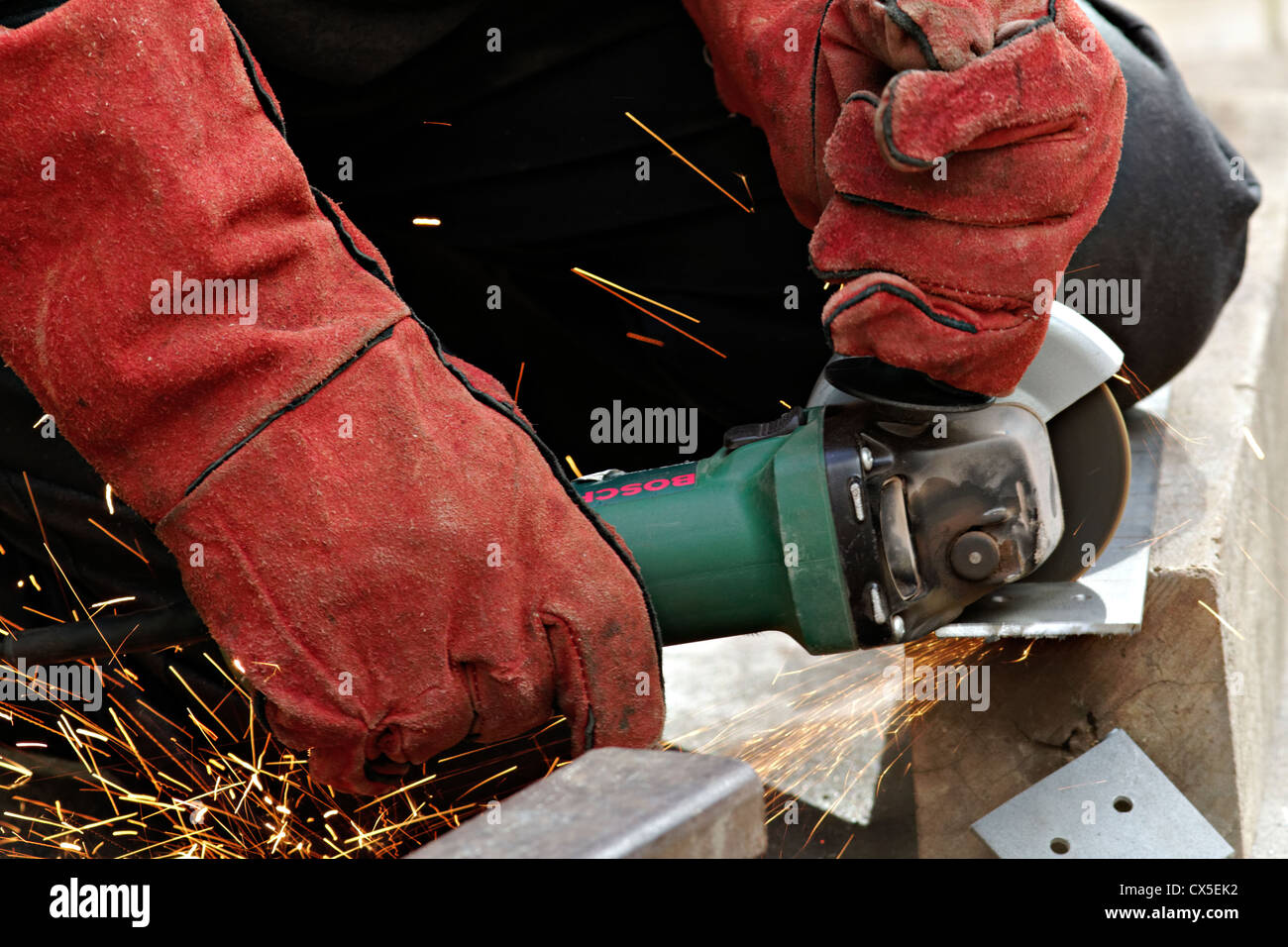 Man cutting metal with a angle grinder Stock Photo Alamy