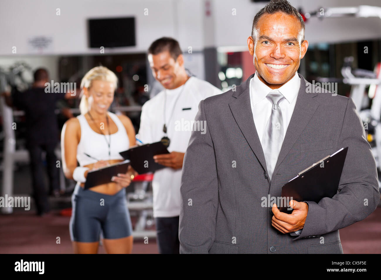 happy gym manager and trainers Stock Photo