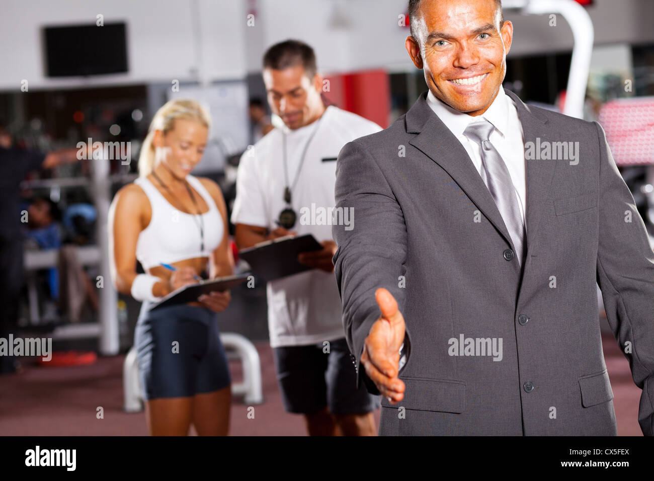Friendly gym manager handshake gesture hires stock photography and images Alamy