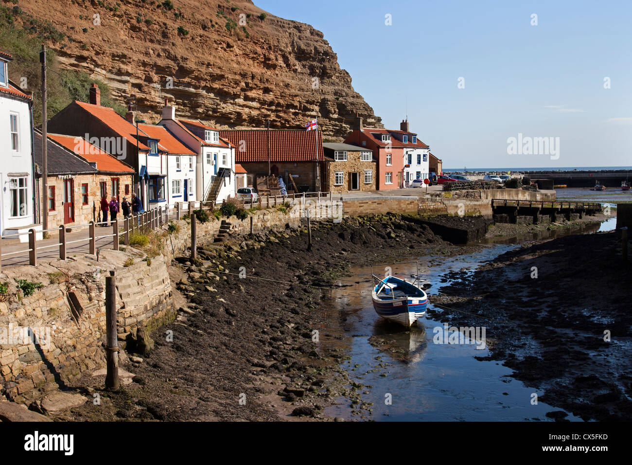The Small Fishing Village of Staithes and its Harbour at Low Tide North Yorkshire UK Stock Photo