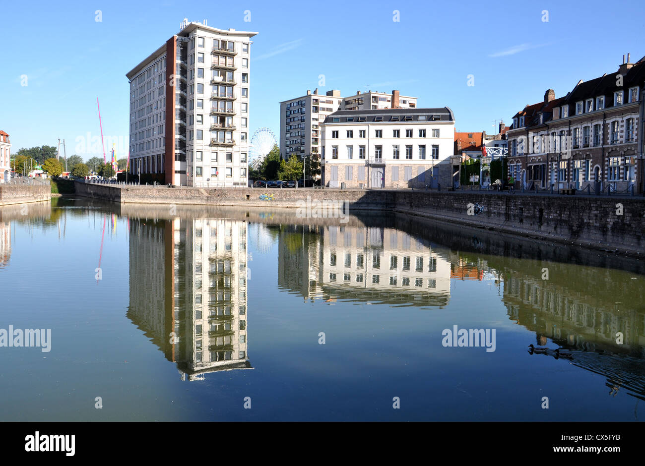 Buildings reflected in a canal Stock Photo