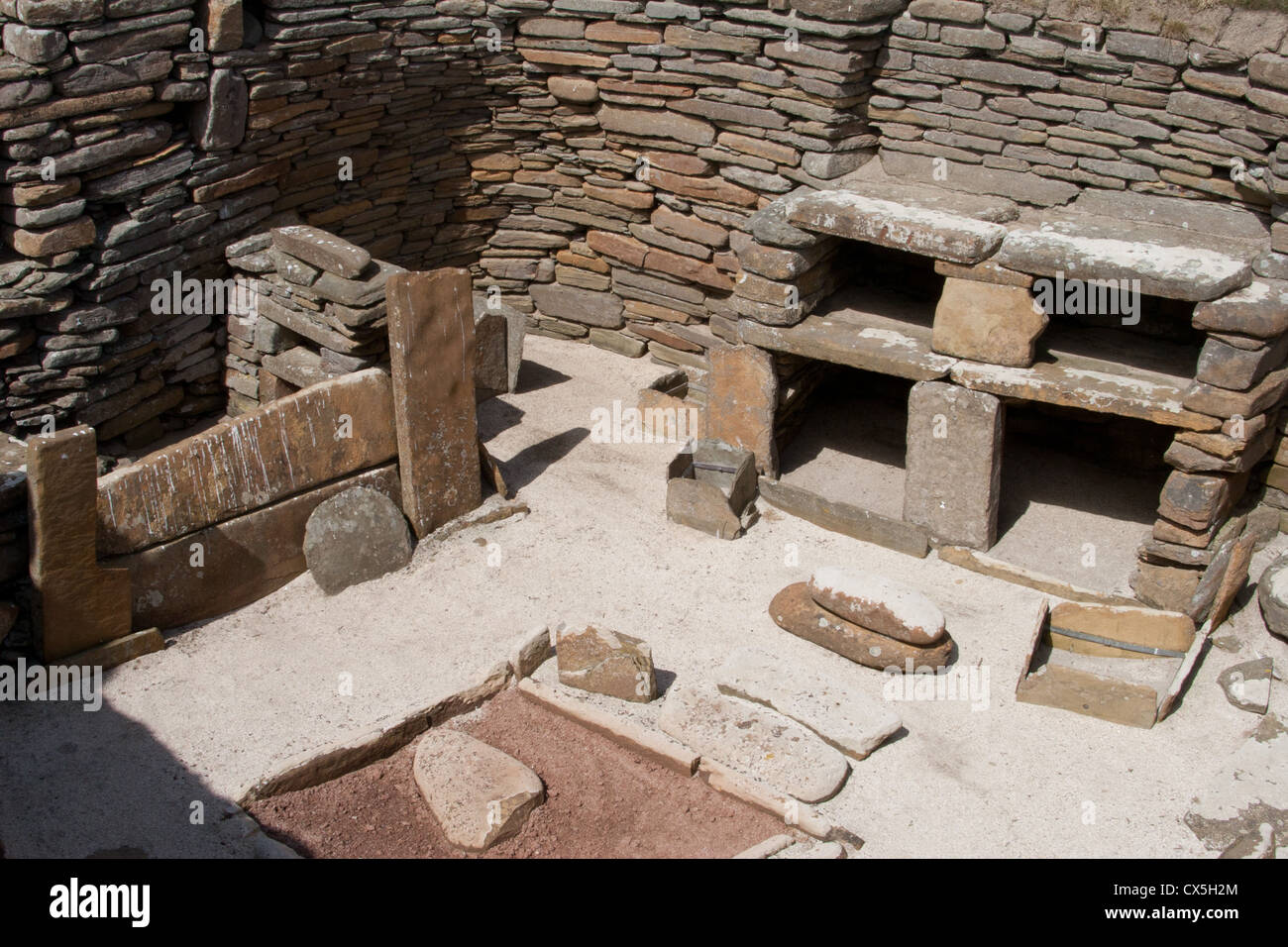 This the photograph of the view inside a neolithic dwelling place in Skara Brae. Stock Photo