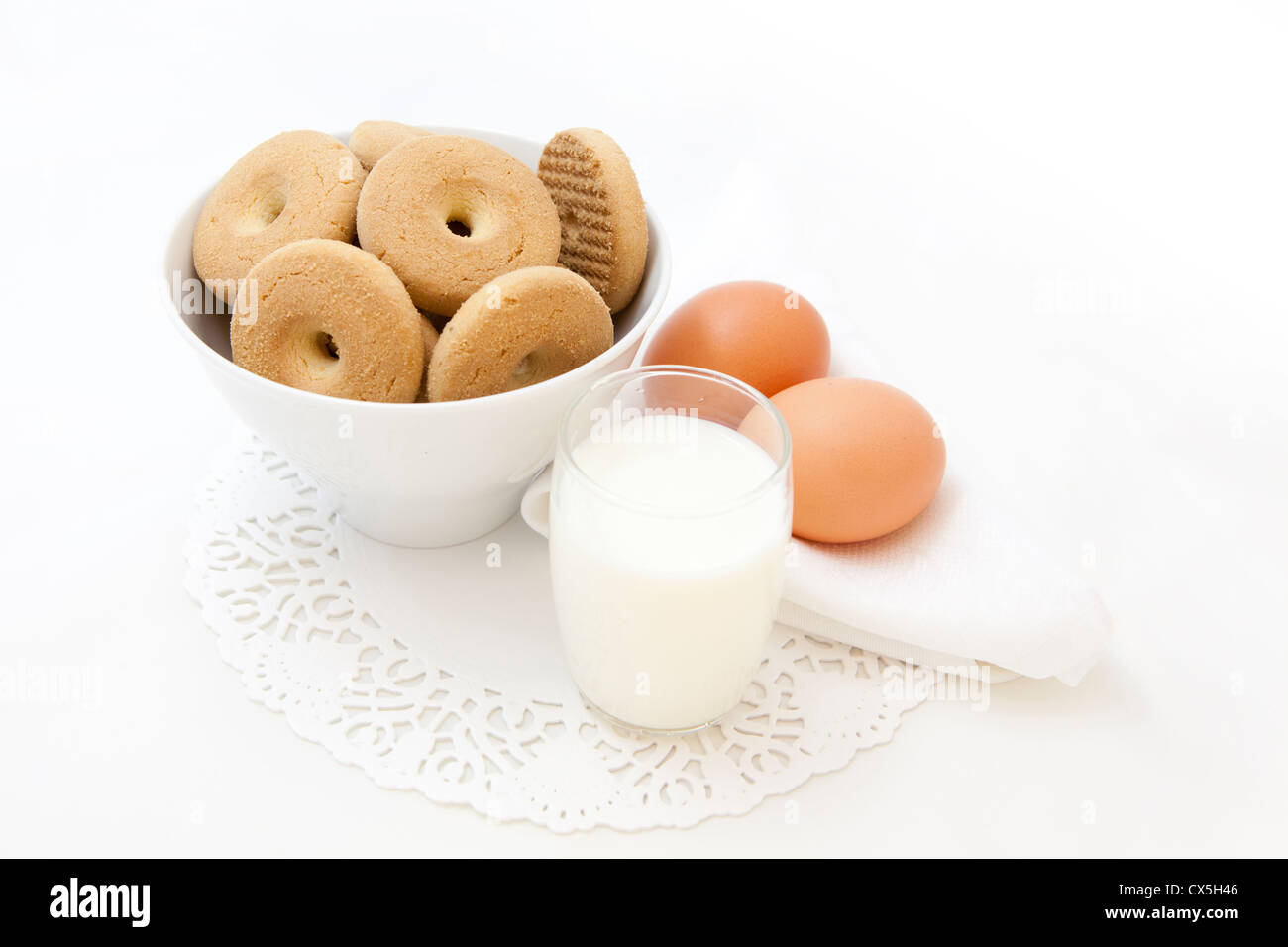 Breakfast set with fresh eggs, biscuits and milk Stock Photo - Alamy