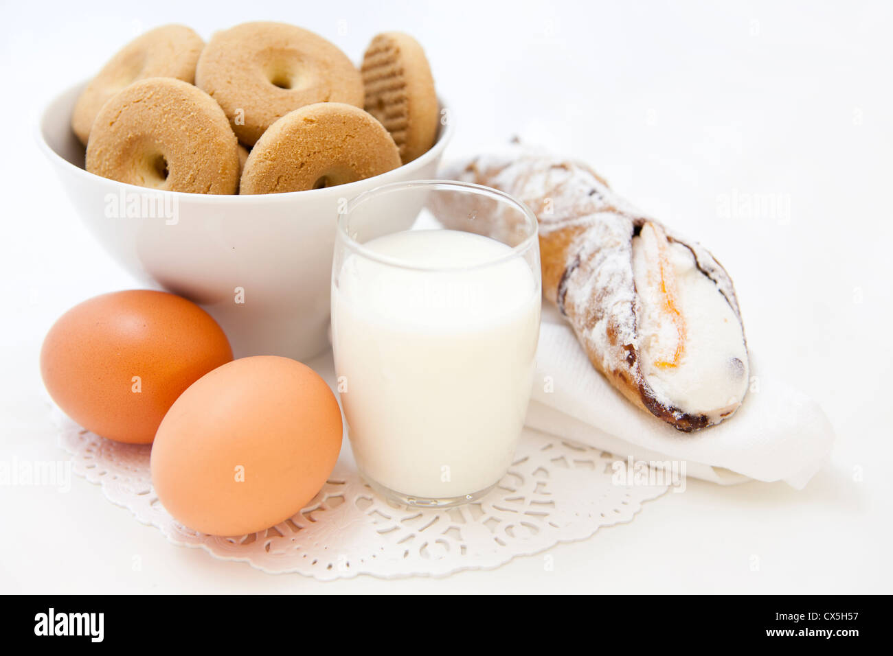 Breakfast set with fresh eggs, biscuits and milk Stock Photo Alamy