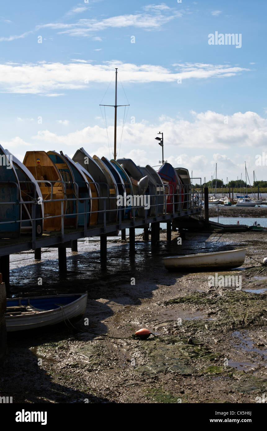 Row of rowing boats, Brightlingsea, Essex Stock Photo