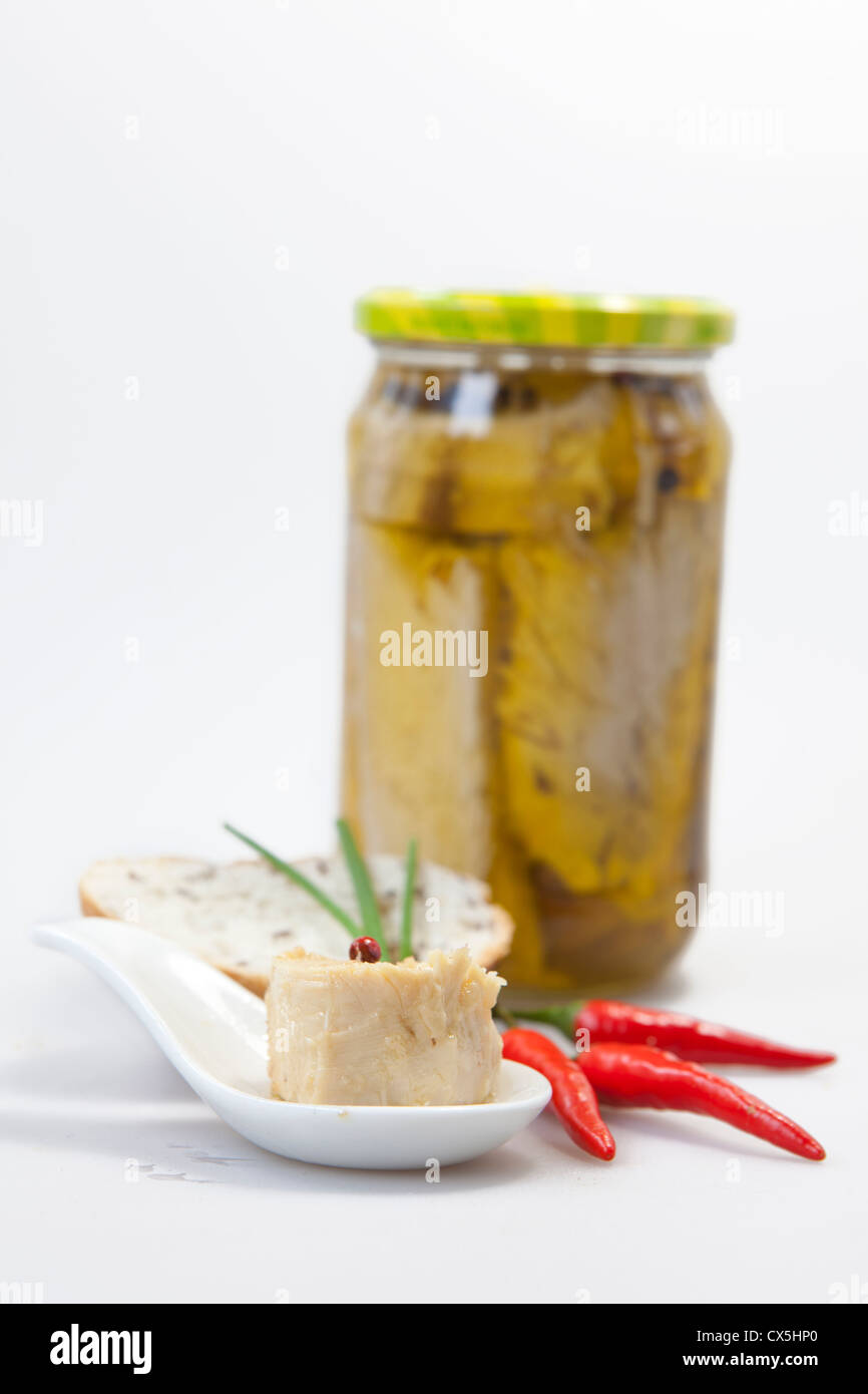 Delicious fresh thuna with red peppers on white background Stock Photo