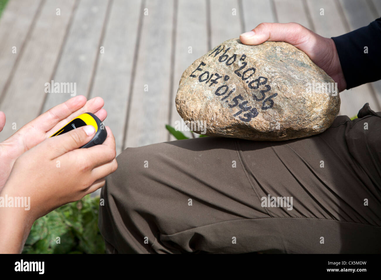 Inputting data during a GPS trek Stock Photo