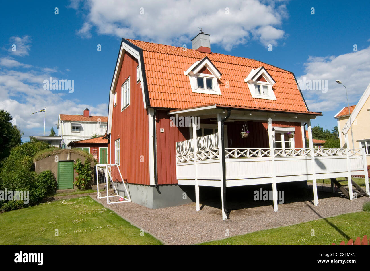 typical red swedish house houses home homes traditional timber wood wooden building buildings falun paint sweden Stock Photo