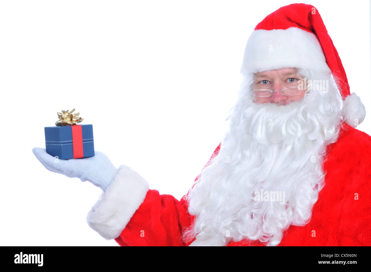 Santa Claus with Present on his extended hand Stock Photo - Alamy