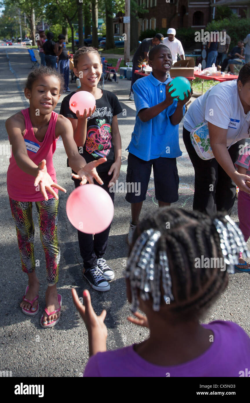 Children Toss Water Balloons at a Detroit Block Party Stock Photo