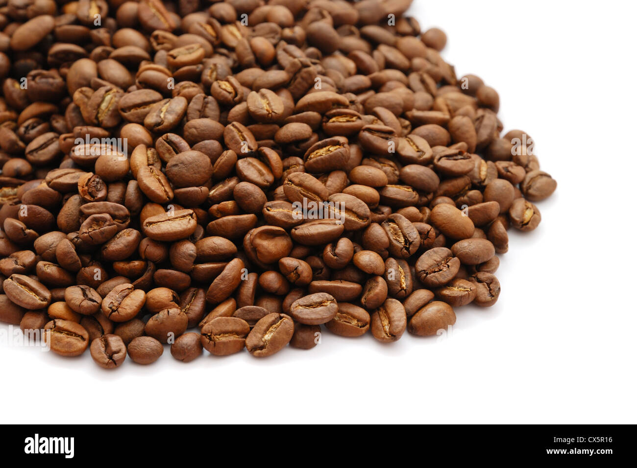 The heap of coffee beans isolated on white background Stock Photo - Alamy