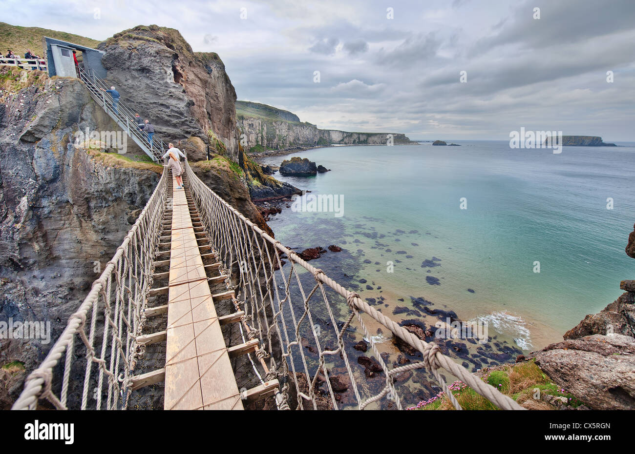 The Carrick-a-Rede Rope Bridge spans two cliff faces in County Antrim on  the coast of Northern Ireland, near the Giants Causeway Stock Photo - Alamy