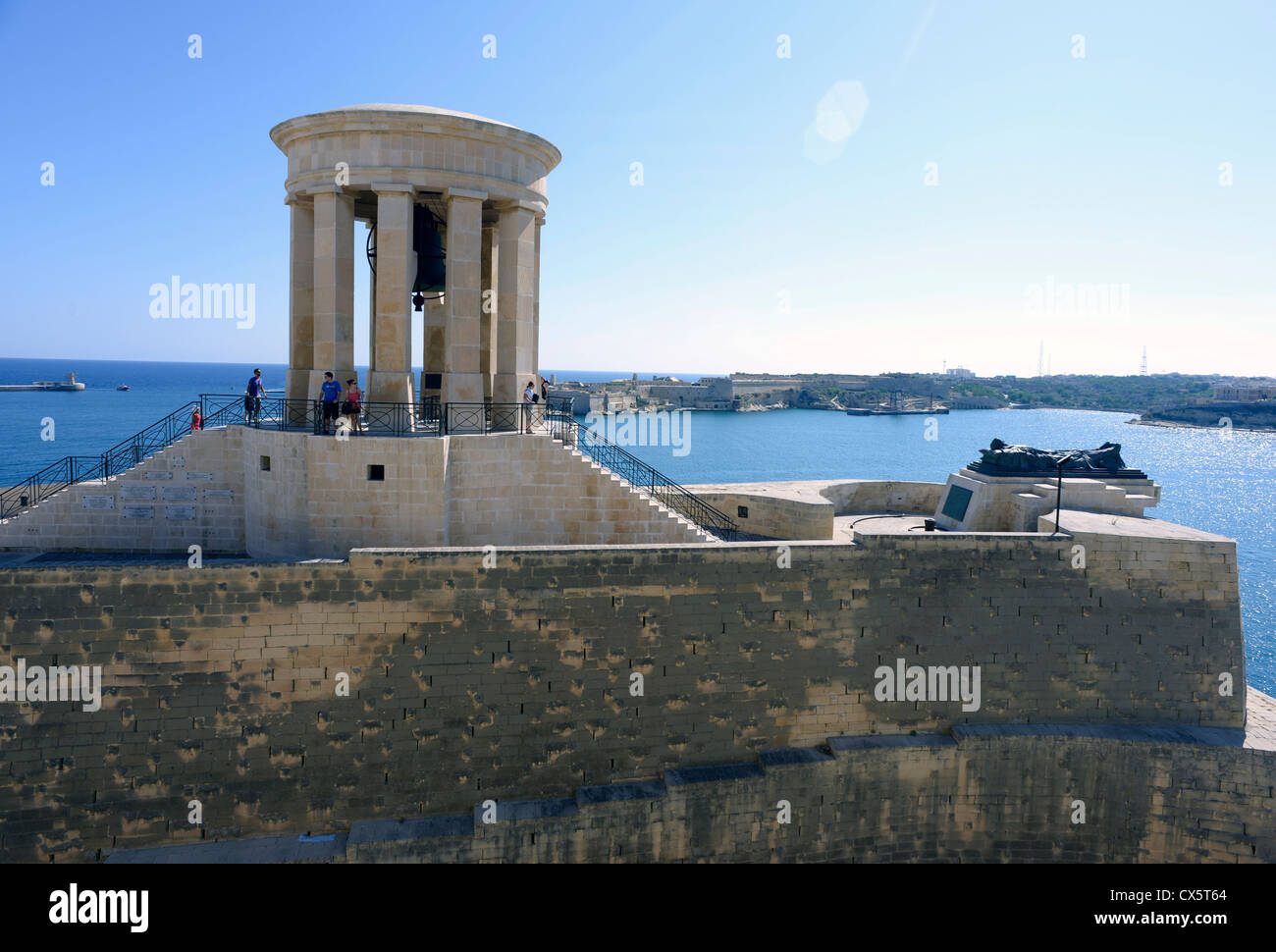 Malta La Valletta Bronze and sandstone War Memorial to the fallen overlooking the the Grand Harbour Stock Photo