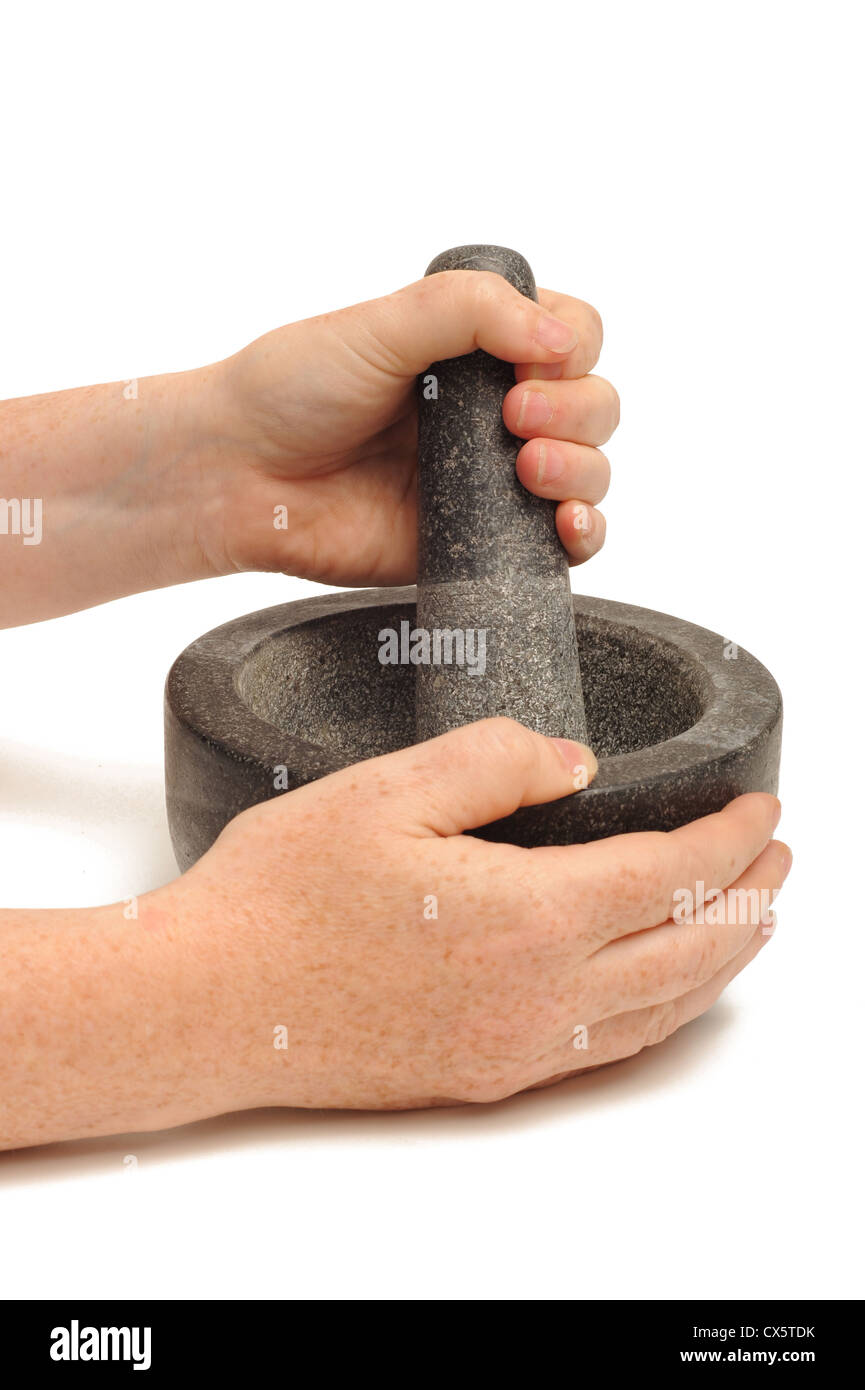Pestle and mortar grinding Stock Photo