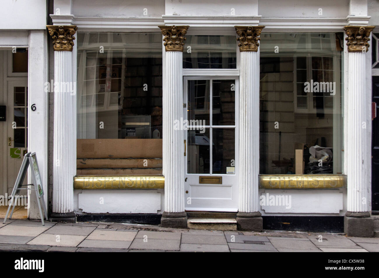 An empty shop (dispensing chemist) in the City of Bath, Somerset Stock Photo