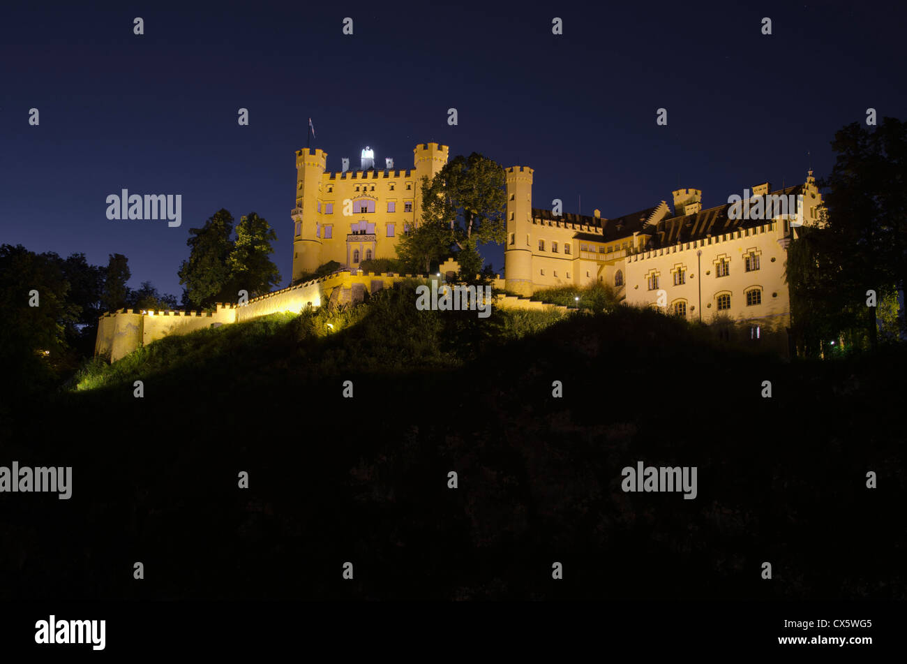 Hohenschwangau Castle proudly stands decorated in light at night Stock ...