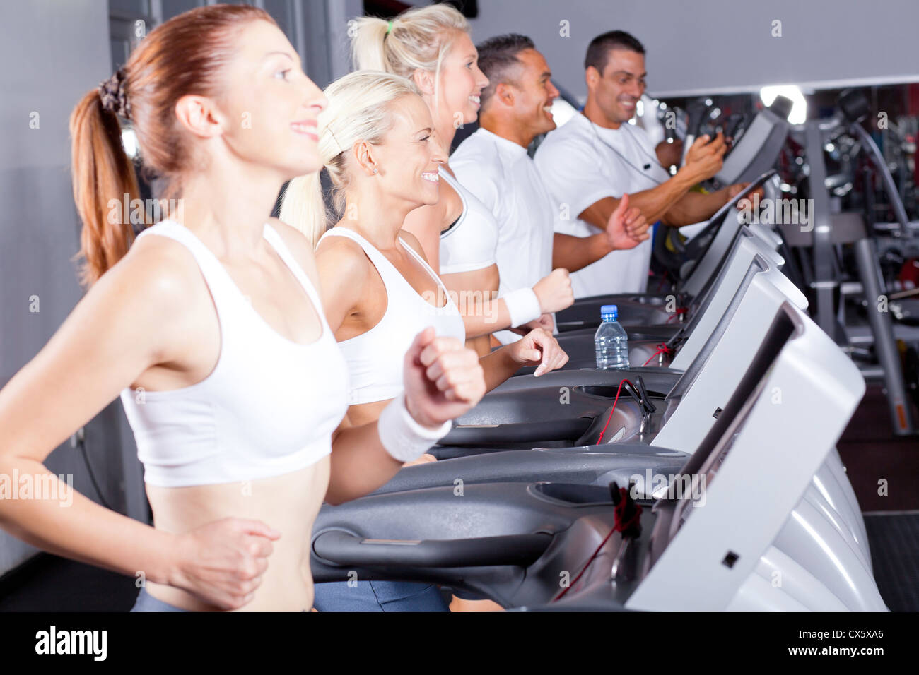 group of fitness people exercising with treadmill in gym Stock Photo ...
