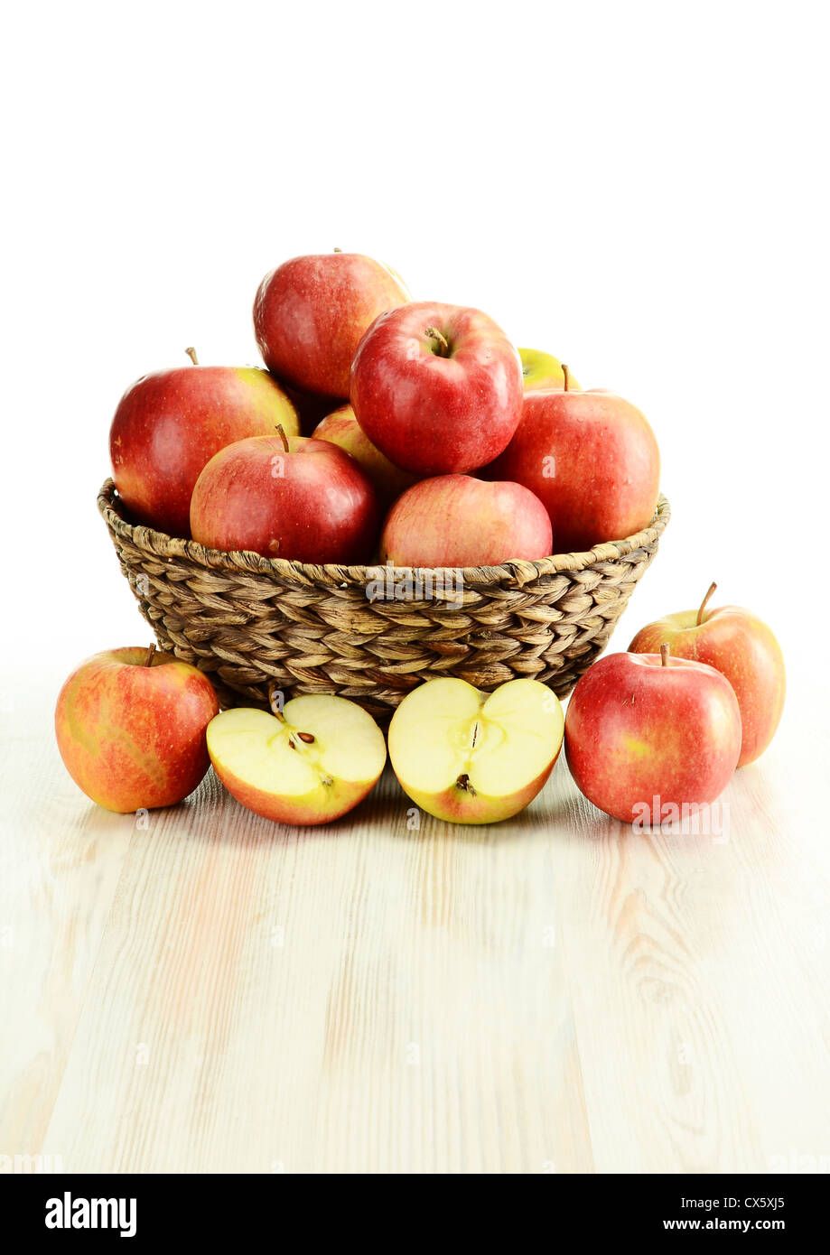 Composition with apples and wicker basket isolated on white Stock Photo ...