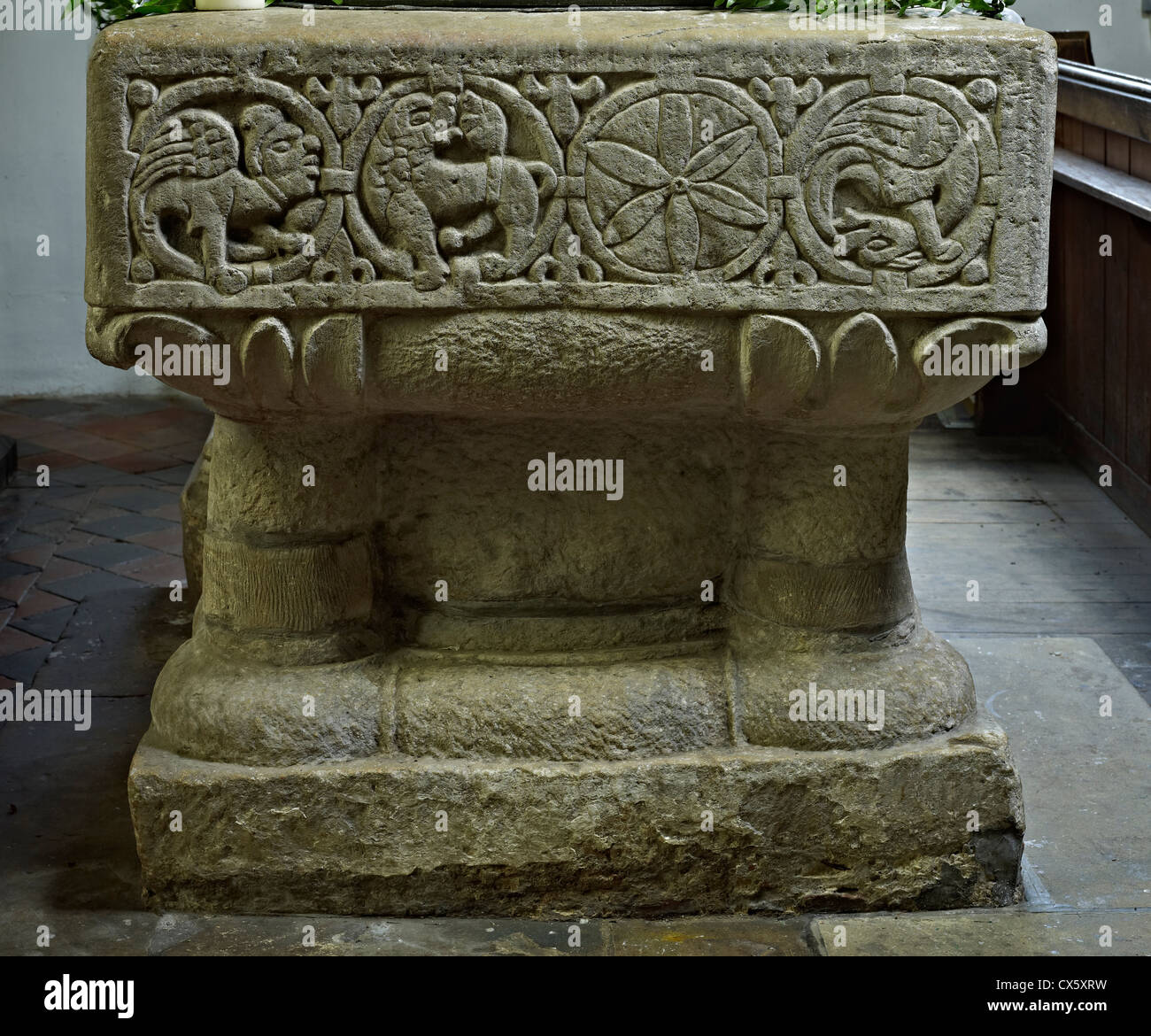 Newenden, Kent. St Peter's Norman font Stock Photo