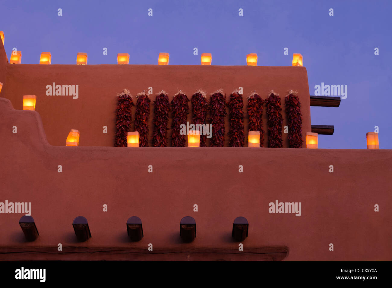 Santa Fe, New Mexico, United States. Traditional farolitos light up adobe structures. Stock Photo