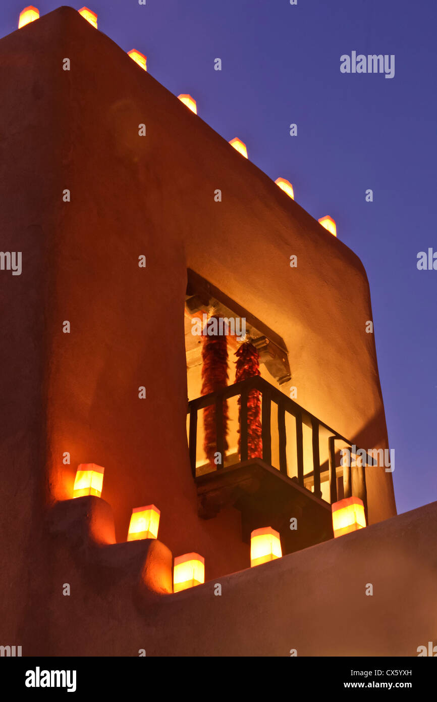 Santa Fe, New Mexico, United States. Traditional farolitos light up adobe structures. Stock Photo
